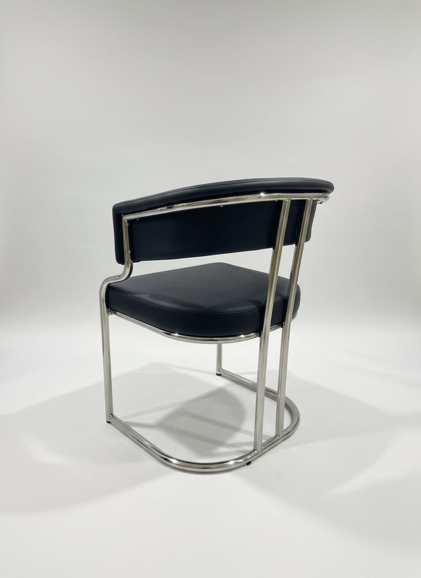 Black chair with chrome frame on a tiled floor